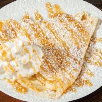 Bananas Foster [Dessert Crepe] · mascarpone, banana & cinnamon sugar topped with whipped cream & a caramel drizzle