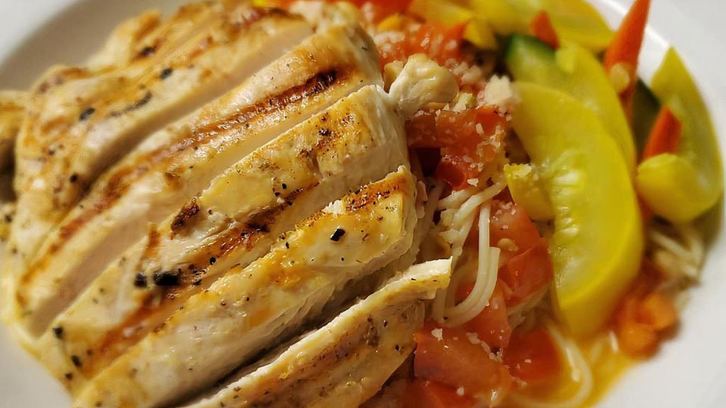 Chicken Pomodoro · Grilled sliced chicken breast, fresh Roma tomatoes, garlic, basil, served over angel hair pasta, topped with toasted pine nuts and served with a side of seasoned vegetables