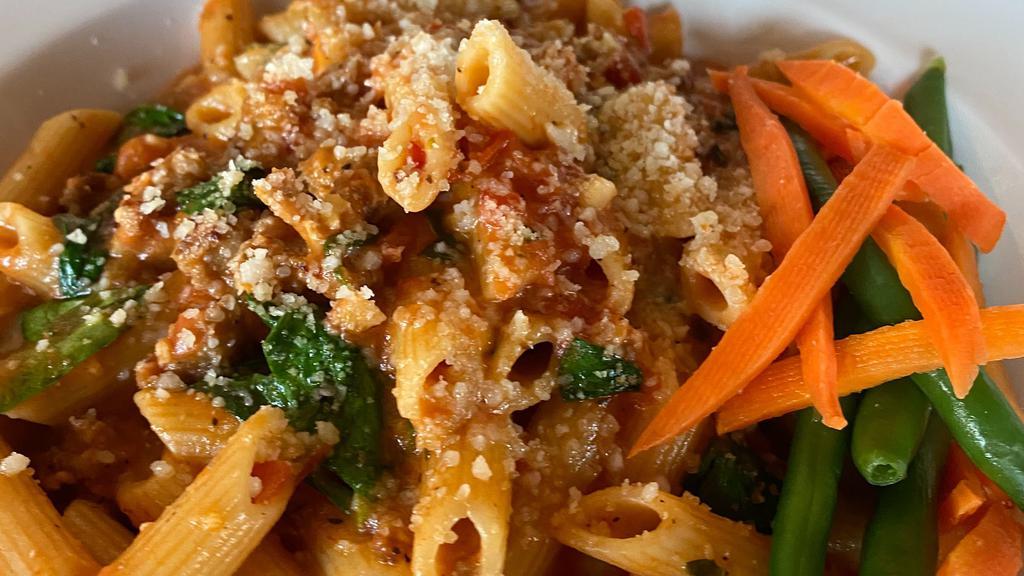 Chef'S Choice Pasta · Italian sausage, garlic, basil and spinach tossed with a creamy tomato-basil marinara sauce over penne pasta.
