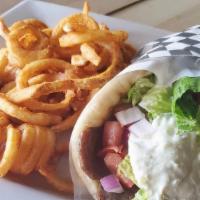 Gyros Pita · A unique blend of lamb and beef seasoned and broiled stuffed in a pita with tzatziki sauce, ...