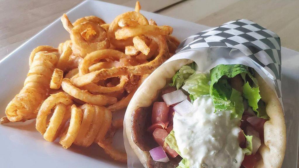 Gyros Pita · A unique blend of lamb and beef seasoned and broiled stuffed in a pita with tzatziki sauce, red onions, lettuce, Roma tomatoes. Served with a side of fries.