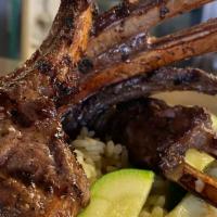 Lamb Chops · Our famous marinated lamb chops charbroiled to perfection, served with rice pilaf and season...