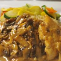Chicken Marsala · Medallions of chicken breast in a marsala white wine sauce, served with rice pilaf and seaso...