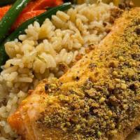 Pistachio Crusted Salmon · Pan seared Salmon served with a delicious lemon-caper beurre blanc, a side of brown rice pil...