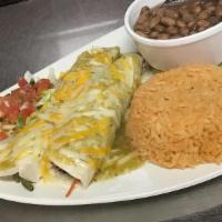 Veggie Enchiladas · Mix of broccoli, zucchini, carrots, mushrooms, and corn. Comes with rice and beans.