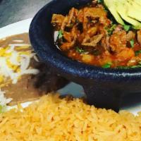 Carnes A La Mexicana · Choice of sautéed meat with molcajete sauce. Served with cilantro, onions and tomatoes.