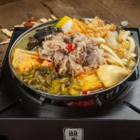 Golden Soup Beef Pot · Sliced beef, shrimp paste, crab stick, beef ball, bunapi mushrooms, fish mushrooms, fish tof...