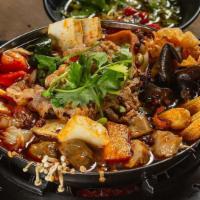 Szechuan Mala Pot · Sliced beef, shrimp paste, beef throat, fish tofu, firm tofu, baby corn, black fungus, fured...