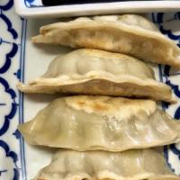 Pot Stickers · Ground chicken and vegetable wrapped with pot sticker wrapper.