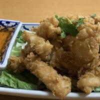 Calamari Rings · Deep fried calamari served with sweet and sour sauce.
