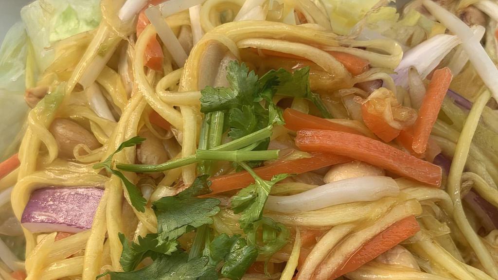 Mango Salad · Shredded green mango with peanut, carrot, bean sprouts and lemon juice.