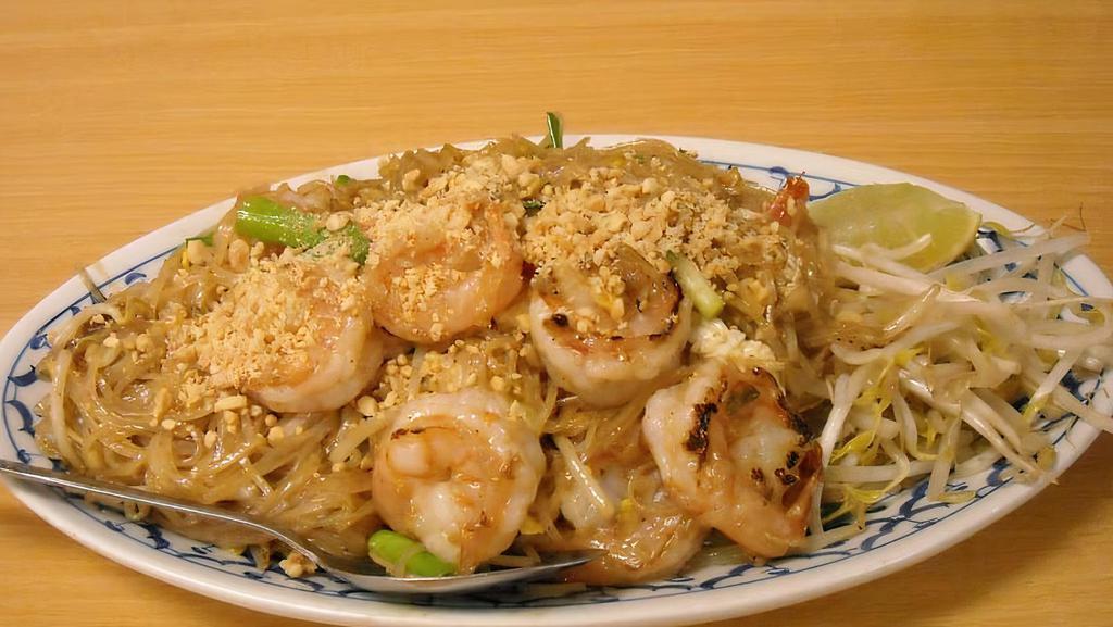 Pad Thai Prawns Or Seafood · Pan-fried small rice noodle choice of prawns or seafood, bean sprouts, egg, onion, and roasted peanut.