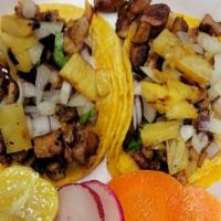 Al Pastor Taco · Marinated pork w/onions and cilantro
