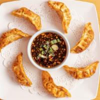Fried Gyoza  · Deep-fried seasoned pot stickers, served with sweet and sour sauce.