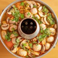 Tom Yum Soup · Chef's recommendation. Spicy and sour soup with, mushrooms, tomatoes, lemongrass, galanga, l...
