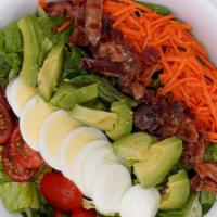 Cobb · Romaine Lettuce, Tomato, Carrot, Hard Boiled Egg, Smoked Bacon, Avocado, Blue Cheese Dressing.