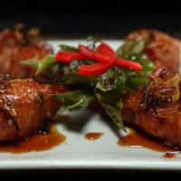Muay Thai Wing Kicks · Favorite. Spicy, gluten free. Thailand's famous hot wings: soy chicken wings cooked in tradi...