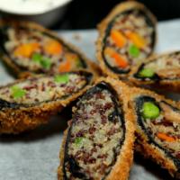 Crispy Seaweed Quinoa Rolls · Nori rolls stuffed with organic quinoa, black soybean tofu, shiitake mushrooms, carrots serv...