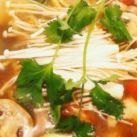 Tom Yum Soup · Spicy, gluten free. Tofu, mushroom, cilantro, tomatoes, exotic herbs in hot and sour lemongr...