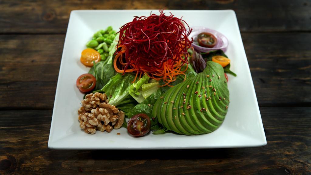 Green Power Salad · Favorite. Gluten free. Spring mix greens, romaine hearts, heirloom tomatoes, carrots, beets, avocado, red dressing, edamame, raw walnut, flax seeds, tossed in our homemade dressing.
