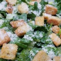 Caesar Salad · Romaine lettuce, parmesan cheese, homemade croutons and Caesar dressing.