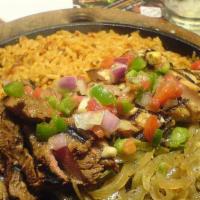 Fajitas · Your choice of meat, chopped veggies, sour cream and tortillas. With a side of refried beans...