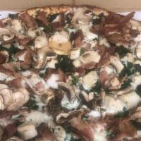 Chicken Alfredo Pizza · Thin crust, alfredo sauce, mozzarella, chicken, mushroom, spinach, bacon.