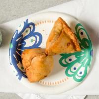 Vegetable Samosas (2) · It contains gluten, vegan. Triangle pastries stuffed with savored peas and potatoes Served w...