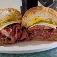 Pastrami Dip · Thinly sliced pastrami simmered in a jus and served on a french roll. Choice of mustard, may...