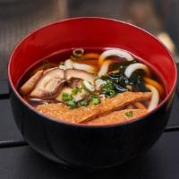 Kitsune Udon Soup · Soy fish broth with deep-fried tofu, mushrooms, and green onion toppings for this is thick n...