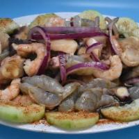 Mixto · Cooked and raw shrimp, scallops, octopus, cucumber, onion, habanero chili.