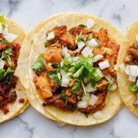 Asada Taco · Our delicious asada topped with onions cilantro and your choice of salsa.