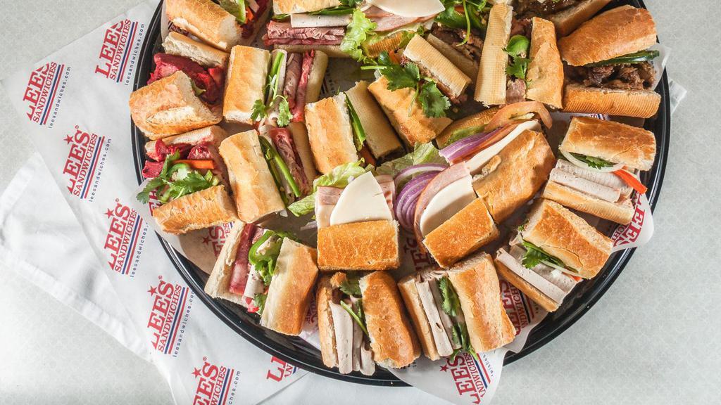 Party Platter Option A · Choice of Lee's combo, grilled chicken, grilled pork, bbq pork, cured pork, pork roll, or pate sandwiches. Includes 21 Asian style sandwiches on approx. 3