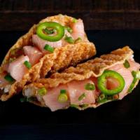 Yellowtail Taco · Yellowtail, Miso Vinegar, Green Onions, Sushi Rice and Serranos in a Gyoza Shell. Order come...