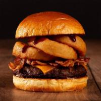 The Bacon Bbq Burger · Beef patty, bacon, fried onion rings, BBQ sauce, and melted cheddar cheese on a brioche bun.