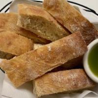 Extra Bread & Pesto Oil  · 8 slices of house ciabatta and 4 oz of pesto dipping oil.