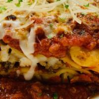 Meat Lasagne · House bolognese, spicy Italian sausage, mozzarella, ricotta, fresh parmigiano.