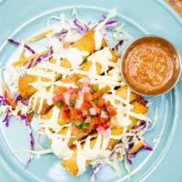 Red Chile Chicken Flautas · Pulled Free Range Red Chile Chicken rolled in Corn Tortillas and fried crisp with Crema, Cot...