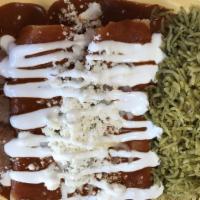 Enchiladas · Lightly Fried Corn Tortillas dipped in Red Enchilada Sauce, rolled with Blended Cheeses, top...