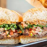 Steak House Tri-Tip Sandwich · Smoked natural tri-tip, fried onion, arugula, mayo, ,  salsa, house-made steak sauce, Italia...