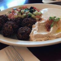 Falafel · Served with salad and tahini.
