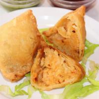 Aloo Samosa (2) · Vegan option available. Crispy fried dumplings stuffed with potatoes and peas