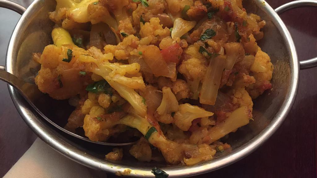 Aloo Gobi · Vegan option available. Cauliflower and potatoes cooked in onion and tomato masala.