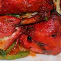 Tandoori Chicken · Seasoned dark and white meat chicken with special spices and yogurt.