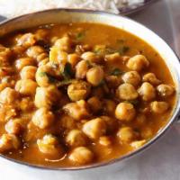 Chana Masala · Vegan option available. Garbanzo beans cooked with onion, garlic, and ginger.