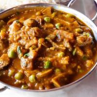 Mushroom Masala · Vegan option available. Mushrooms and peas curry cooked with spices & herbs.