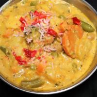Veg Korma · Sautéed mixed vegetables cooked in creamy sauce, topped with nuts, raisins.