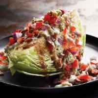 Classic Wedge Salad · Iceberg, ranch and balsamic dressing, hickory bacon, diced tomato, bleu cheese crumbles. Can...