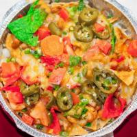 Fiesta Nachos · Three color corn chips with whole beans, melted cheese, tomatoes, green onion, jalapeños, gu...