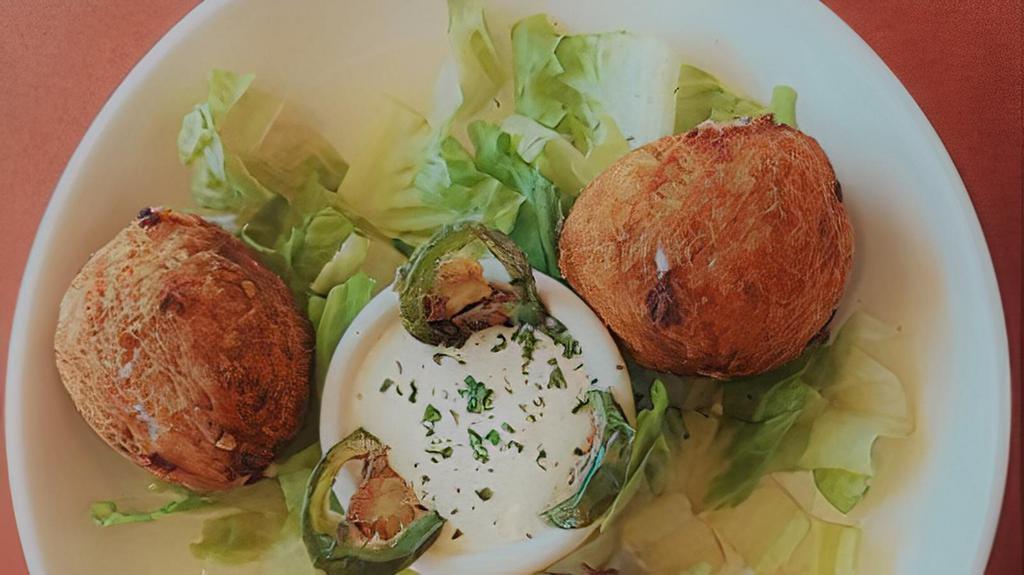 Jalapeño Poppers · Jalapeño Poppers
Fried balls stuff with three cheese blend, cream cheese and grilled Jalapeños served with Jalapeño infused Ranch sauce.